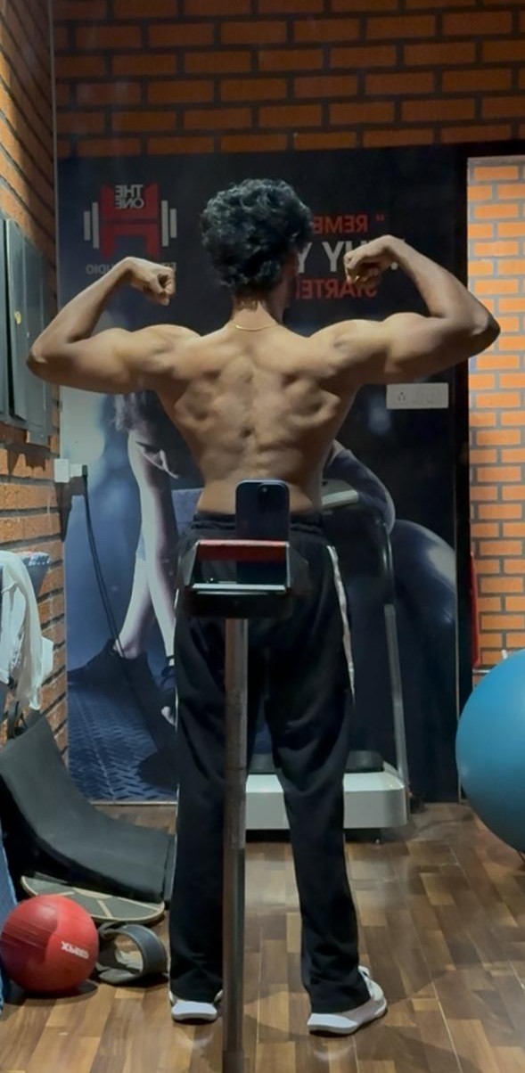 Client back transformation after photo showing V-taper and muscle definition
