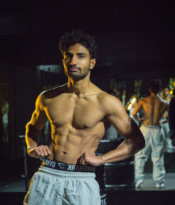 Client fitness transformation after photo with visible six-pack abs and lean physique